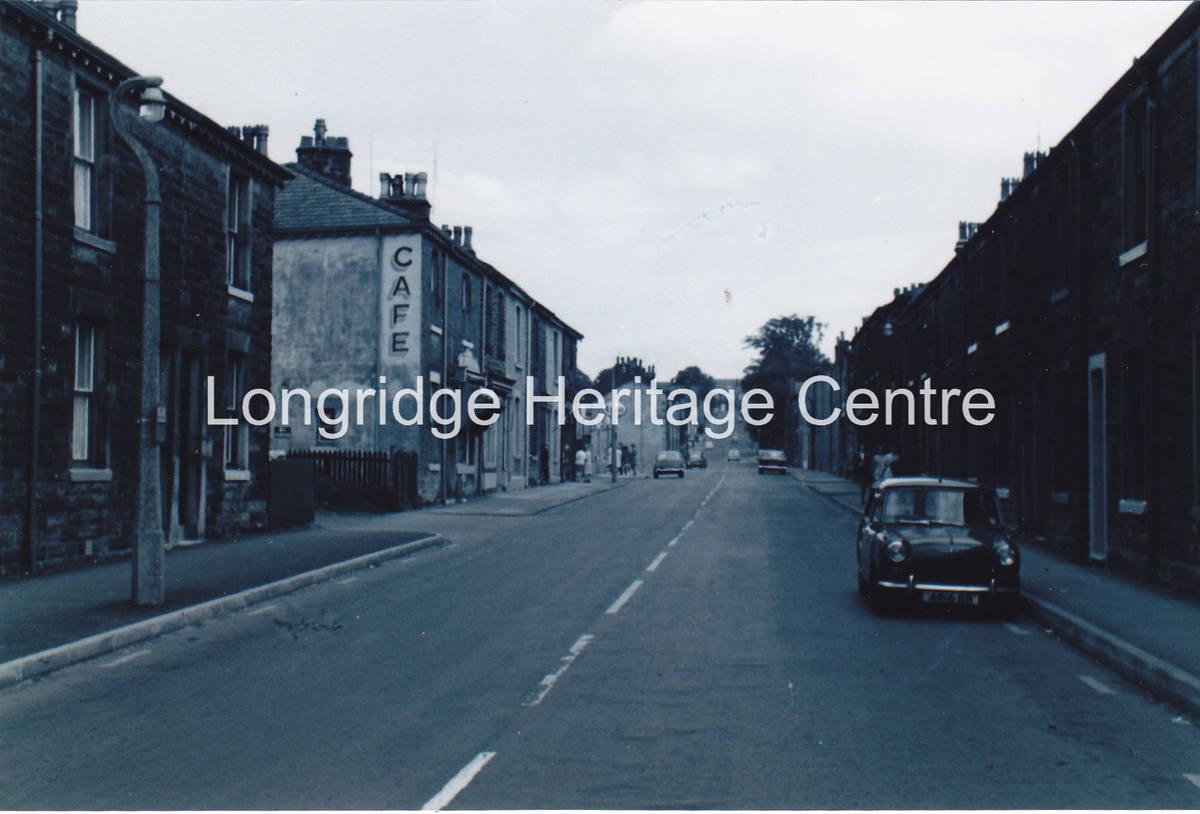 626B - Berry Lane - Looking uphill from outside Bare Dry Cleaners - 1970